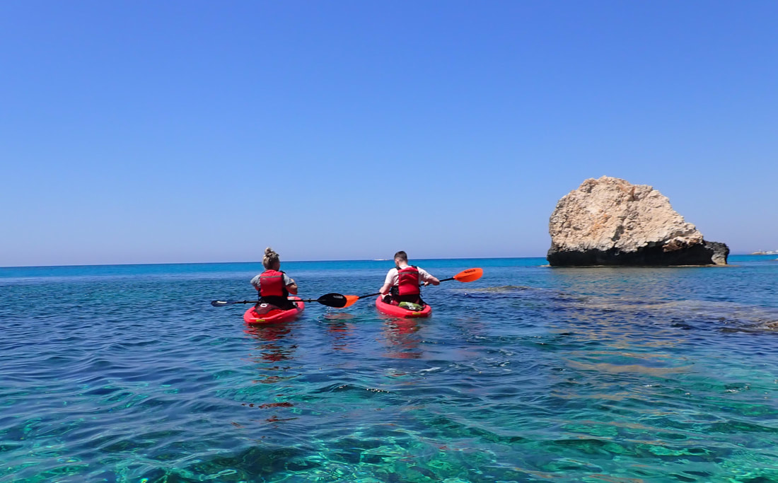 Two sea kayakers in crystal clear waters