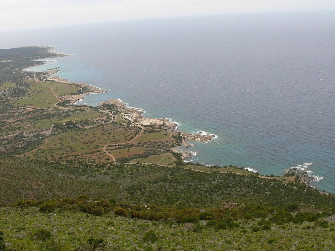 Coastal view of many coves while walking down from a coastal steep hill