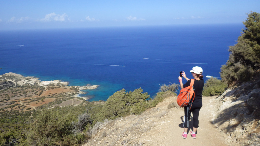 A walker standing on Aphrodite trail in Akamas